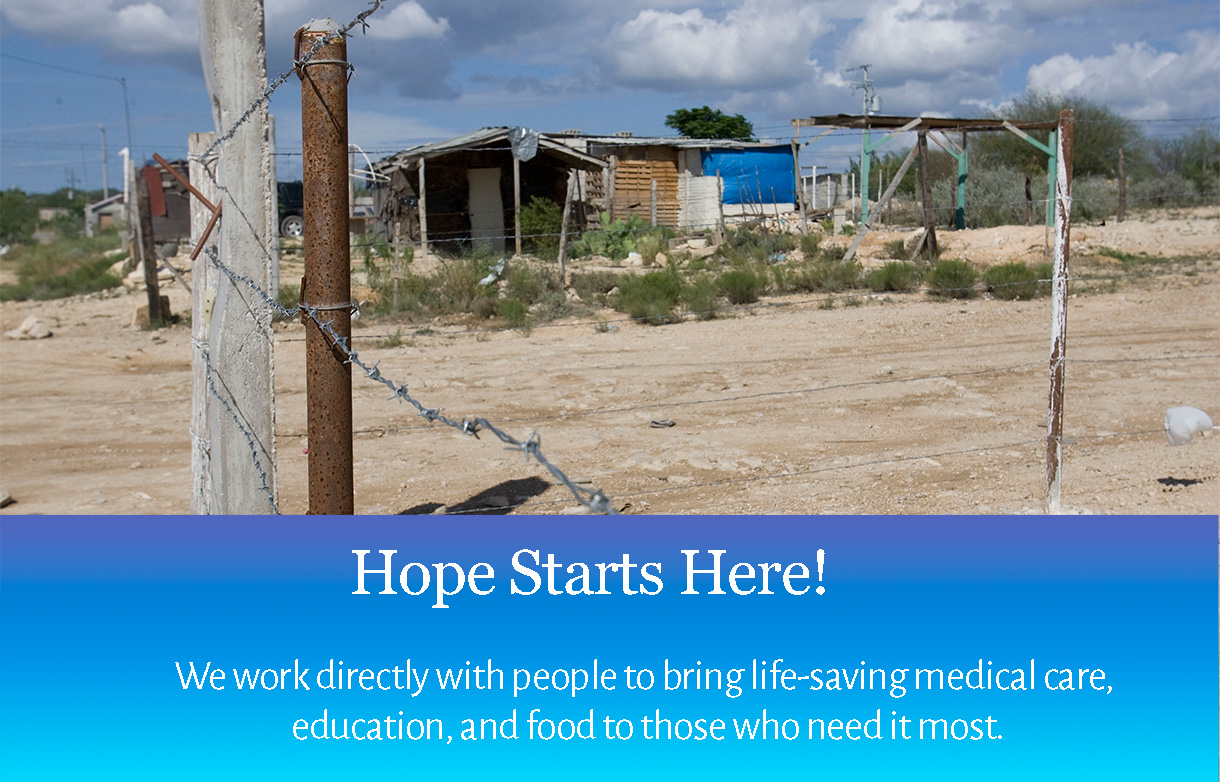 Boys in street between shacks